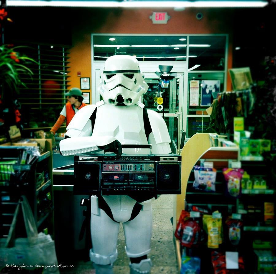 Stormtrooper in a store holding a boombox.